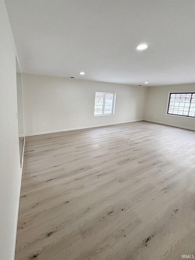 spare room featuring light hardwood / wood-style floors