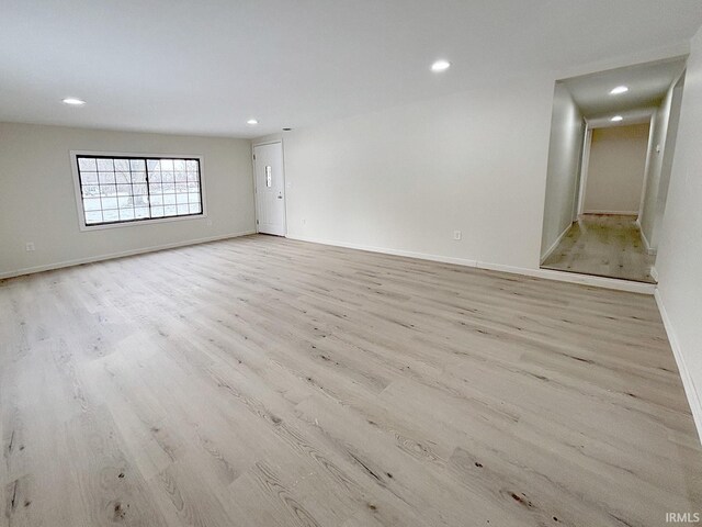 spare room with light hardwood / wood-style floors