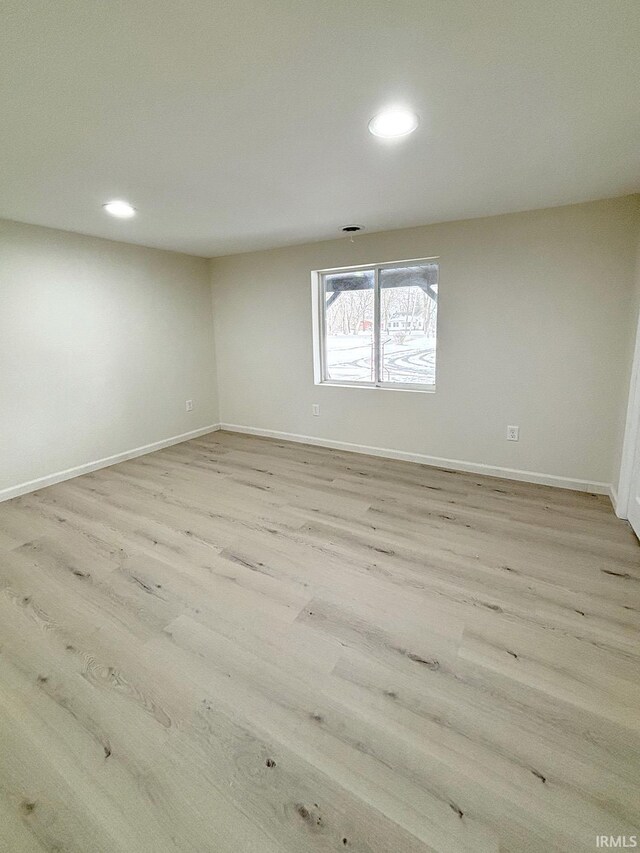 unfurnished room featuring light hardwood / wood-style flooring