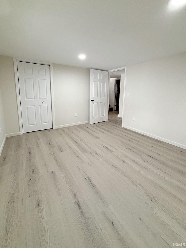 interior space featuring light wood-type flooring and a closet