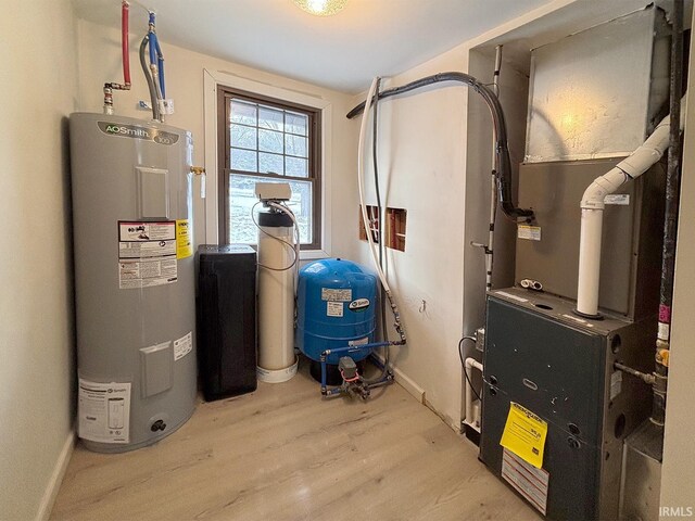 utility room featuring heating unit and water heater