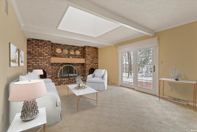 living room featuring beamed ceiling, a textured ceiling, a brick fireplace, and ornamental molding