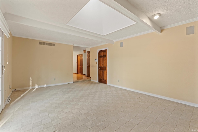 empty room with beamed ceiling, a textured ceiling, and ornamental molding