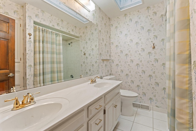 bathroom featuring tile patterned flooring, vanity, toilet, and a shower with shower curtain