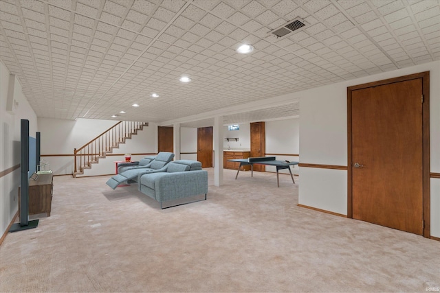 unfurnished living room featuring light colored carpet