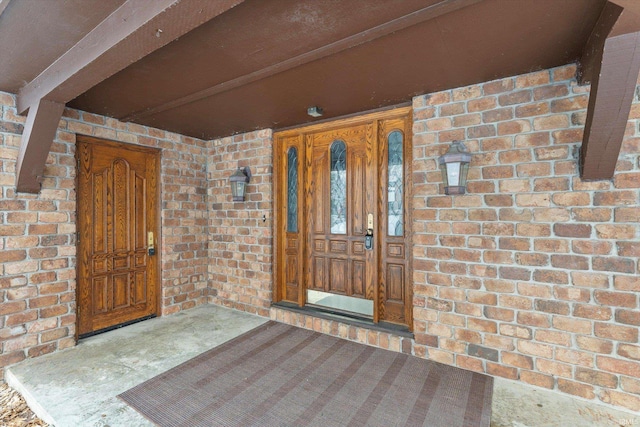 entrance to property featuring a porch