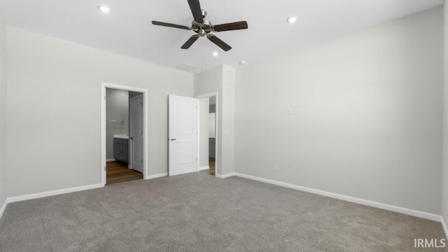 unfurnished bedroom with recessed lighting, carpet flooring, and baseboards
