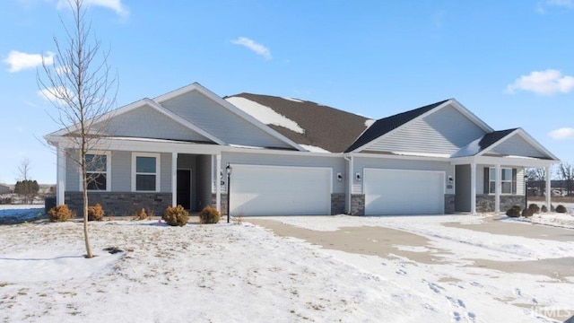 view of front of home featuring stone siding and an attached garage