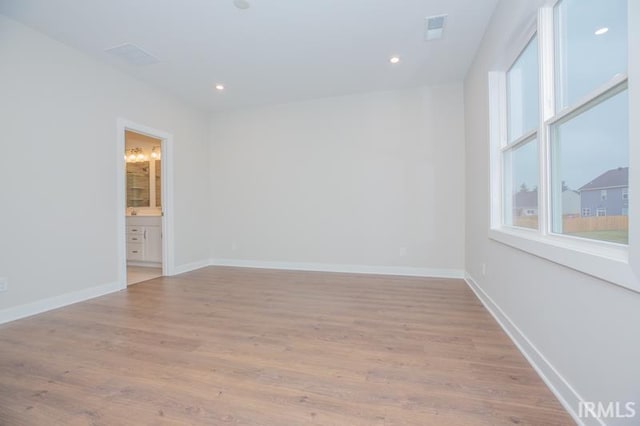 unfurnished room featuring light hardwood / wood-style flooring