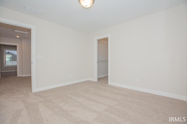 empty room featuring light colored carpet