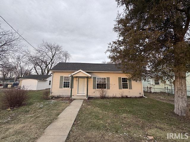 view of front of home with a front yard