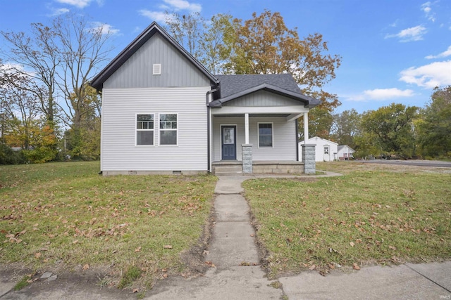 view of front of house with a front yard and a porch