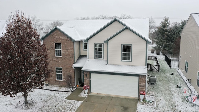 front of property featuring central AC and a garage