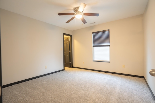 carpeted empty room with ceiling fan