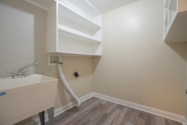 washroom featuring hardwood / wood-style floors and sink