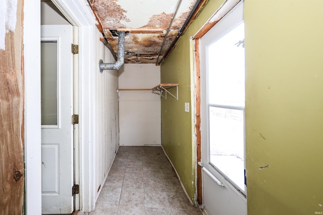 corridor with light tile patterned flooring