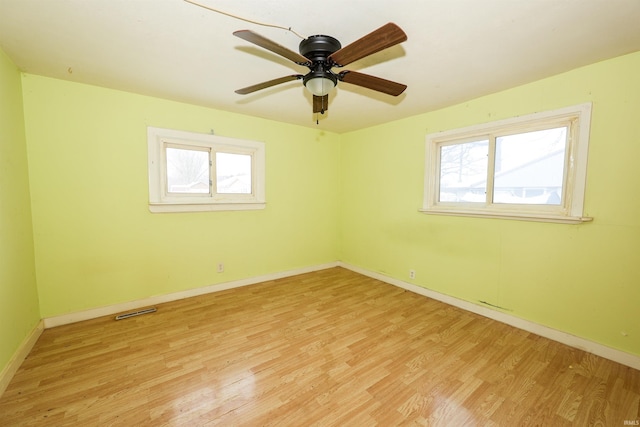 empty room featuring ceiling fan and light wood-type flooring