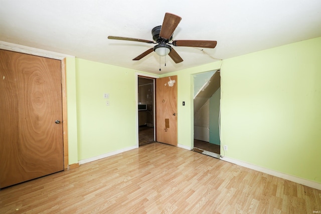 unfurnished bedroom featuring ceiling fan and light wood-type flooring