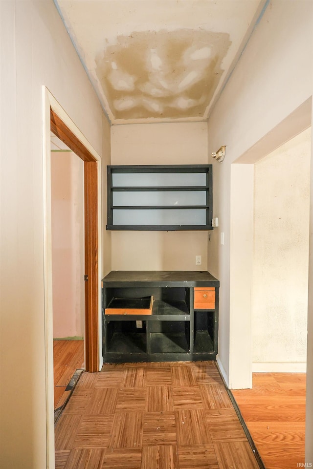 hallway featuring parquet floors