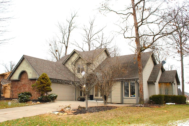 view of front facade with a front yard and a garage