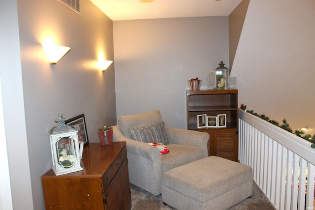 sitting room featuring carpet