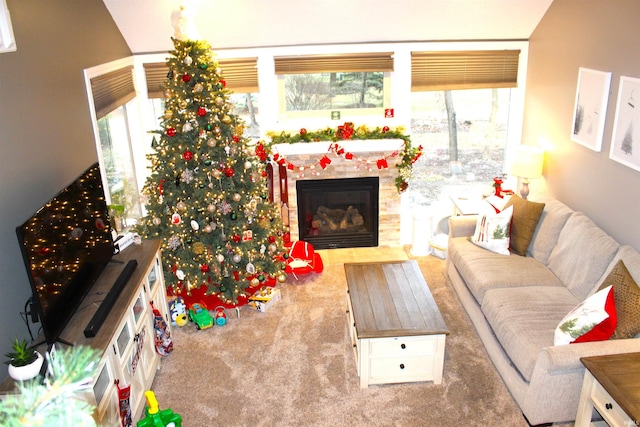 carpeted living room featuring a fireplace