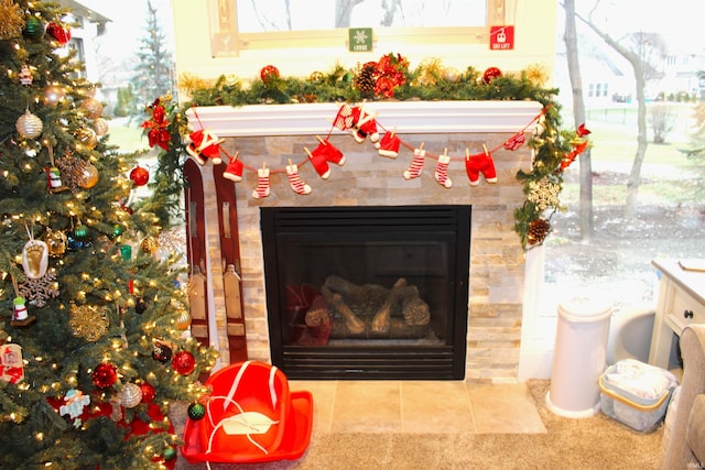 interior details with a tiled fireplace