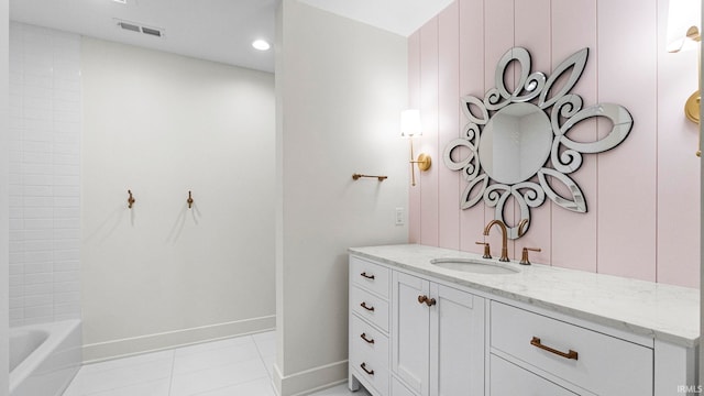 bathroom featuring tile patterned flooring and vanity