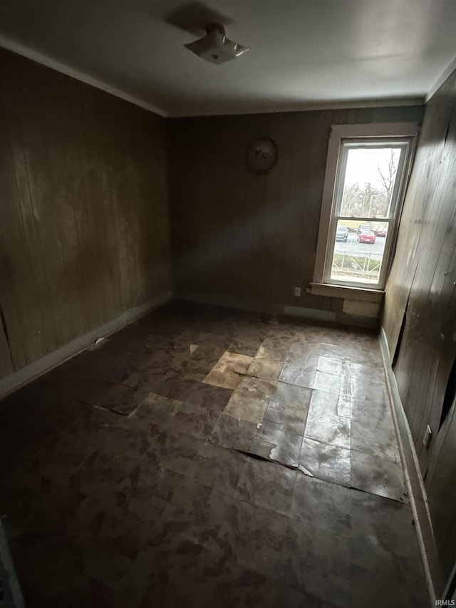 empty room featuring wooden walls