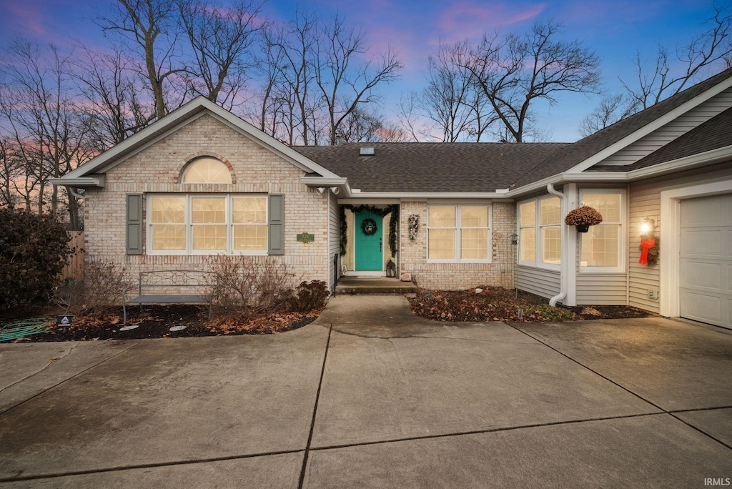 ranch-style home featuring a garage