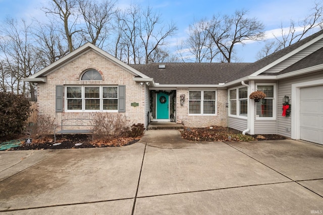 ranch-style home featuring a garage