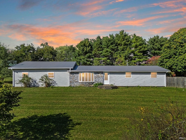 view of front of property with a lawn