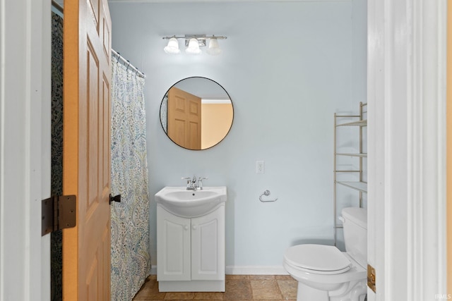 bathroom featuring toilet and sink