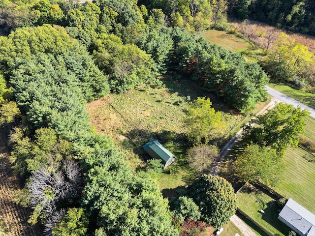 birds eye view of property with a rural view