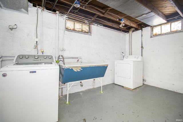 laundry room featuring washer and dryer, laundry area, and a sink