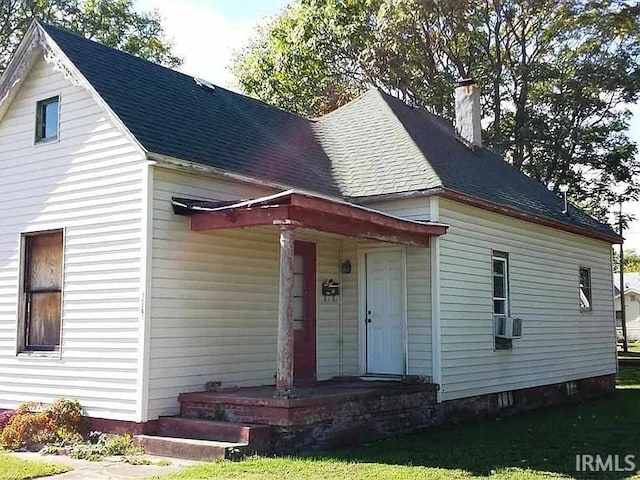 view of front of home featuring cooling unit