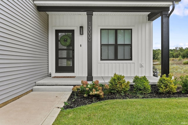 doorway to property featuring a yard