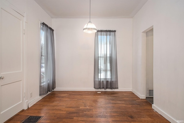 spare room with dark hardwood / wood-style flooring