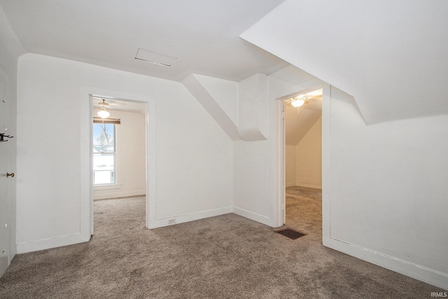 bonus room with carpet floors, vaulted ceiling, and ceiling fan