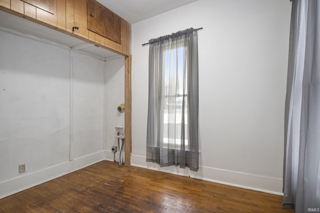 empty room featuring dark hardwood / wood-style flooring