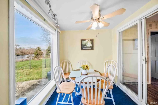 dining space featuring ceiling fan