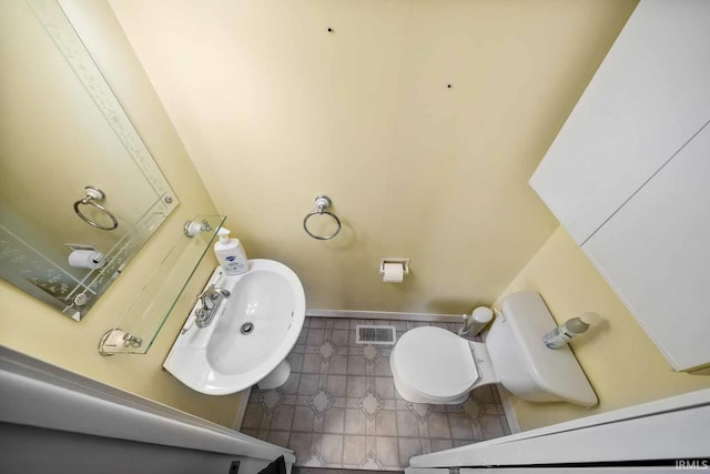 bathroom with sink and toilet