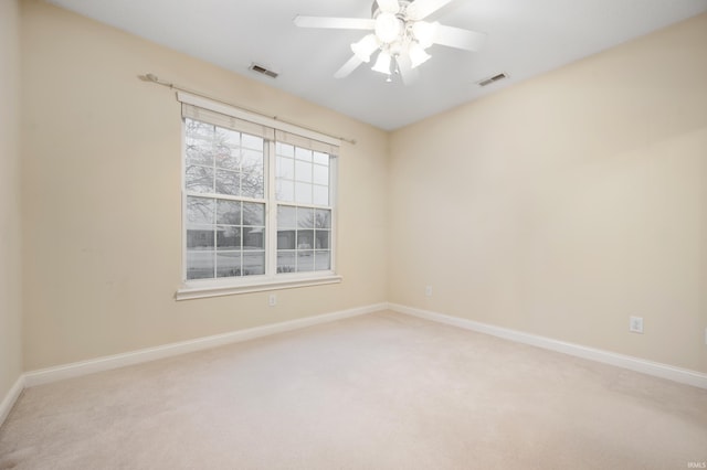 unfurnished room with carpet flooring and ceiling fan