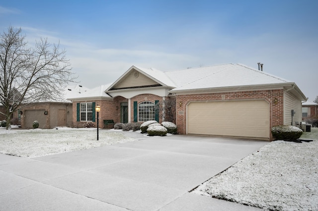 single story home with a garage and central AC unit