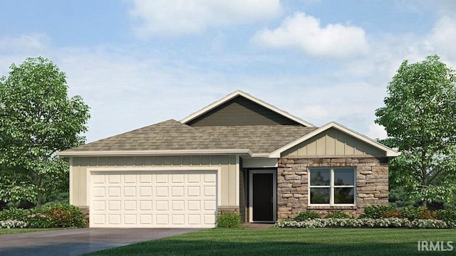 view of front of house with a front yard and a garage