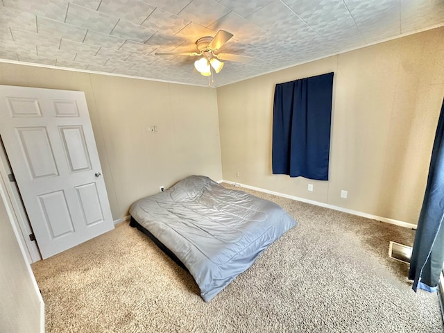 bedroom with ceiling fan and carpet