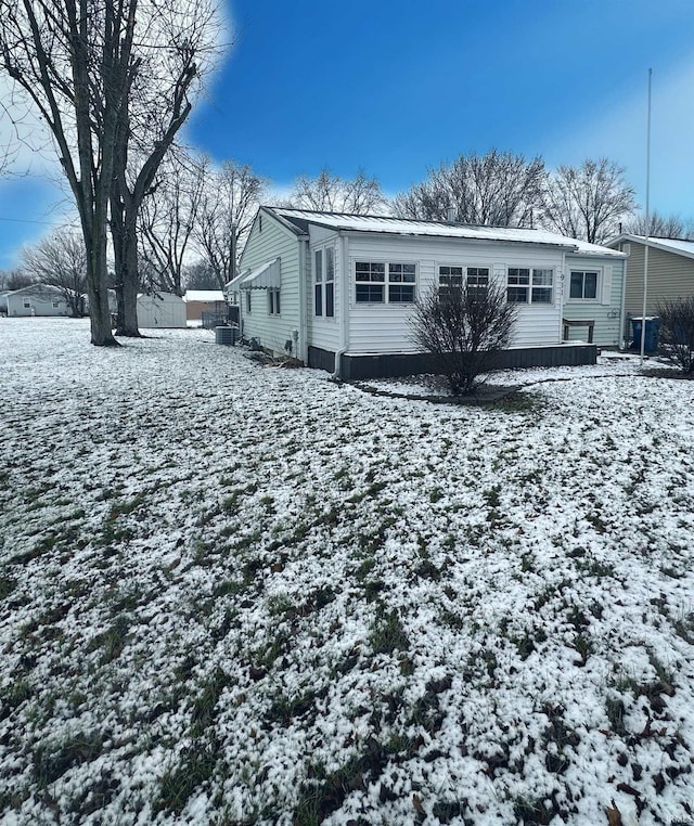 view of snow covered house