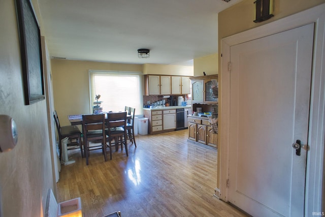 dining space with light hardwood / wood-style floors