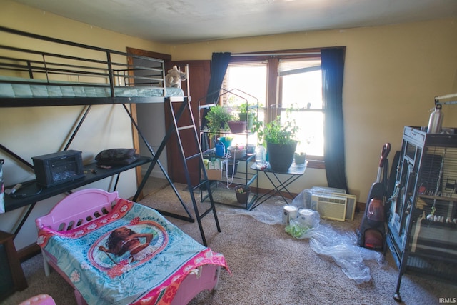 carpeted bedroom featuring an AC wall unit