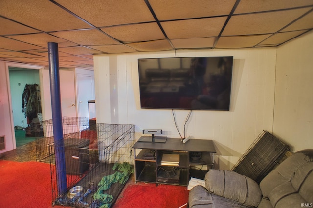 living room featuring a paneled ceiling